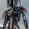 DALL·E 2022-06-22 14.52.31 - a fifteen foot tall humanoid amalgamation made out of robot parts...png