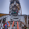 DALL·E 2022-06-22 14.52.28 - a fifteen foot tall humanoid amalgamation made out of robot parts...png
