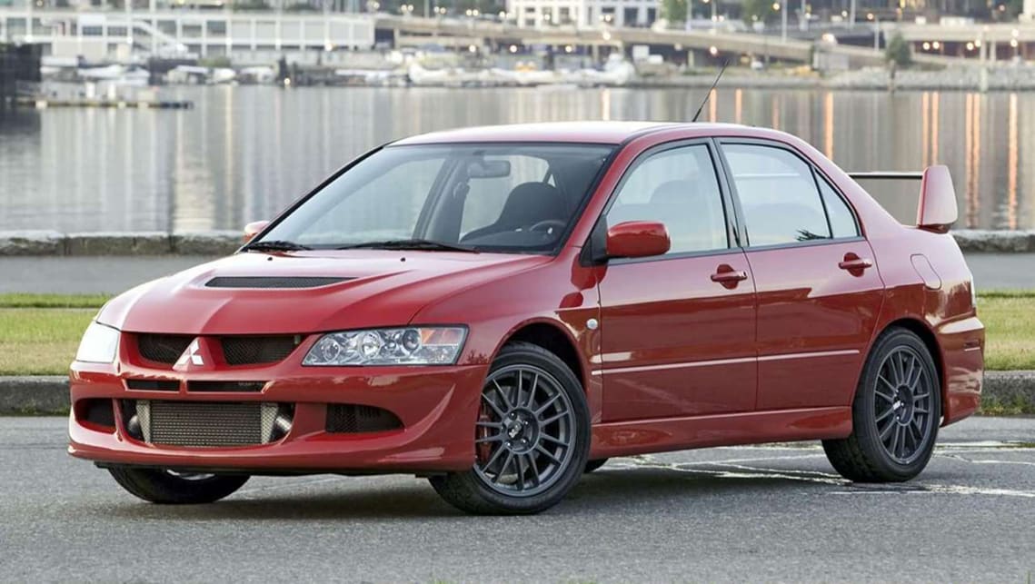 2005-Mitsubishi-Lancer-Evo-Sedan-Red-Press-Image-1001x565p.jpg