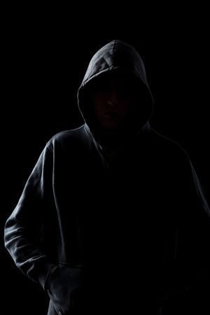 46591460-silhouette-of-faceless-guy-in-hoodie-in-the-darkness-concepts-of-danger-crime-terror.jpg