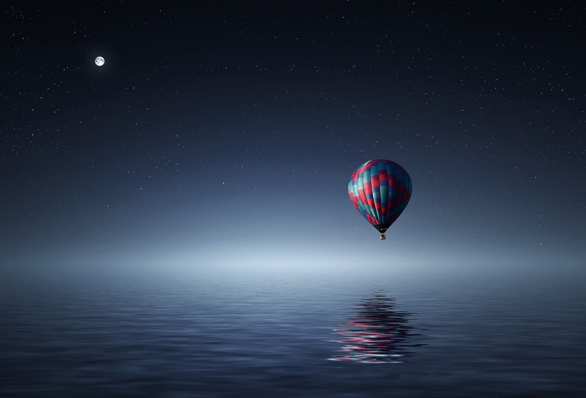 red-and-blue-hot-air-balloon-floating-on-air-on-body-of-36487.jpg