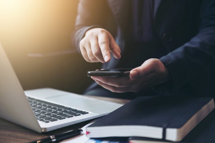 Professional business woman working with smartphone, Doing finance on laptop, document graph and analysis business strategy to development profit.